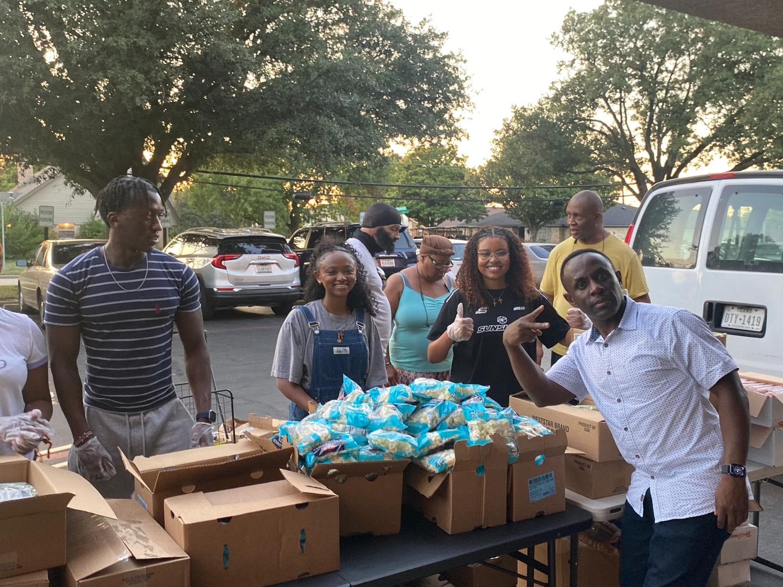 College student volunteers helping distribute food
